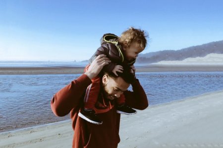 Dad and baby on beach